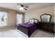 Cozy bedroom with neutral tones, two windows, and carpet offers a comfortable retreat at 663 Warm Springs Ct, Loganville, GA 30052