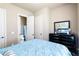 Bedroom with ensuite bathroom featuring a comfortable bed and black wood dresser at 663 Warm Springs Ct, Loganville, GA 30052