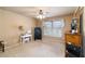 Bedroom features a ceiling fan, large window, and vanity desk at 663 Warm Springs Ct, Loganville, GA 30052