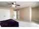 Large bedroom with double doors, neutral tones, carpet, and ample closet space provides comfort and storage at 663 Warm Springs Ct, Loganville, GA 30052