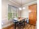 Charming breakfast nook with granite table, seating for four, and natural light at 663 Warm Springs Ct, Loganville, GA 30052