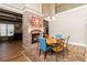 Elegant dining area featuring a fireplace, wooden table, and stylish decor, perfect for Gathering gatherings at 663 Warm Springs Ct, Loganville, GA 30052