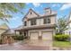 Charming two-story home featuring a two-car garage, landscaped yard, and inviting covered porch at 663 Warm Springs Ct, Loganville, GA 30052