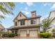 Charming two-story home featuring a two-car garage, landscaped yard, and inviting covered porch at 663 Warm Springs Ct, Loganville, GA 30052