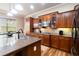 Gourmet kitchen with granite counters, island seating, stainless appliances, and ample storage at 663 Warm Springs Ct, Loganville, GA 30052