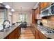 Well-equipped kitchen with granite counters, stainless appliances, and eat in breakfast area at 663 Warm Springs Ct, Loganville, GA 30052
