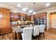 Gourmet kitchen with granite counters, island with seating, and stainless steel appliances at 663 Warm Springs Ct, Loganville, GA 30052