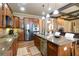 Gourmet kitchen featuring granite counters, kitchen island, stainless appliances, and ample cabinets at 663 Warm Springs Ct, Loganville, GA 30052