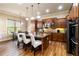 Gourmet kitchen with island, granite countertops, stainless steel appliances, and pendant lighting at 663 Warm Springs Ct, Loganville, GA 30052