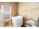 Functional laundry room with washer, dryer, shelving, and utility sink at 663 Warm Springs Ct, Loganville, GA 30052