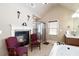 Bright main bathroom with shower, tub, fireplace, and neutral color palette at 663 Warm Springs Ct, Loganville, GA 30052