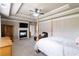 Luxurious main bedroom with a fireplace and sitting area, creating a cozy and inviting retreat at 663 Warm Springs Ct, Loganville, GA 30052