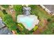 Aerial view of a community pool with trees and landscaping at 663 Warm Springs Ct, Loganville, GA 30052