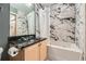 Bathroom with tub and shower, granite countertops, decorative tile and modern fixtures at 791 Wylie Se St # 410, Atlanta, GA 30316