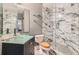 Bathroom featuring tiled walk-in shower, granite vanity, and modern glass bowl sink at 791 Wylie Se St # 410, Atlanta, GA 30316