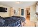 Cozy bedroom with wood flooring and double doors and access to bathroom and closet at 791 Wylie Se St # 410, Atlanta, GA 30316