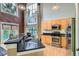 Modern kitchen with granite countertops, stainless appliances, and large windows for natural light and brick facade at 791 Wylie Se St # 410, Atlanta, GA 30316