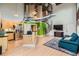 Bright living space features open floor plan, stainless steel appliances, and spiral staircase to loft at 791 Wylie Se St # 410, Atlanta, GA 30316