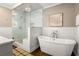 Luxurious bathroom with a freestanding tub, a glass-enclosed shower, and modern fixtures at 23 Clifton Ne St, Atlanta, GA 30317