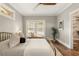 Cozy bedroom featuring a metal bed frame, a window bench, and a walk in closet at 23 Clifton Ne St, Atlanta, GA 30317