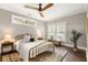 Bright bedroom with a large window, hardwood floors, and a ceiling fan at 23 Clifton Ne St, Atlanta, GA 30317