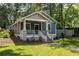 Craftsman-style home features a covered front porch, walkway, and a well-maintained lawn at 23 Clifton Ne St, Atlanta, GA 30317