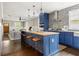 Modern kitchen with a large island, stainless steel appliances, and stylish pendant lighting at 23 Clifton Ne St, Atlanta, GA 30317