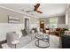 Cozy living room featuring a modern sofa, elegant decor, and large windows at 23 Clifton Ne St, Atlanta, GA 30317