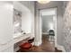 Stylish home office space with a modern desk, chair, and unique wallpaper at 23 Clifton Ne St, Atlanta, GA 30317