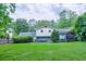 Lush backyard with patio table and chairs at 2592 Dresden Dr, Atlanta, GA 30341