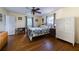 Bright bedroom features hardwood floors, a ceiling fan, and ample natural light from the windows at 2592 Dresden Dr, Atlanta, GA 30341