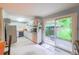 Spacious kitchen area with tile flooring and direct access to the outdoor patio, ideal for al fresco dining at 2592 Dresden Dr, Atlanta, GA 30341