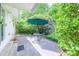 Cozy patio space with an umbrella-covered table, perfect for enjoying the lush, landscaped yard at 2592 Dresden Dr, Atlanta, GA 30341