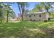 Expansive backyard featuring a lush lawn and mature trees, perfect for outdoor activities at 3456 Maryvale Dr, Decatur, GA 30032