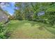 Lush backyard surrounded by mature trees, offering privacy and a natural setting at 3456 Maryvale Dr, Decatur, GA 30032
