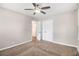 Bedroom featuring plush carpet, closet and fresh neutral paint at 3456 Maryvale Dr, Decatur, GA 30032