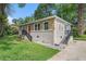 Charming home with a brick foundation, stone veneer, and a welcoming red front door at 3456 Maryvale Dr, Decatur, GA 30032