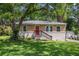 Charming brick home with a red front door and freshly landscaped front yard at 3456 Maryvale Dr, Decatur, GA 30032