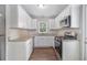 Updated kitchen featuring stainless steel appliances, granite countertops and white cabinets at 3456 Maryvale Dr, Decatur, GA 30032
