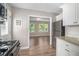 View of the kitchen leading into the bright and airy living room space at 3456 Maryvale Dr, Decatur, GA 30032