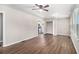 Open floor plan living room with modern ceiling fan and hardwood floors at 3456 Maryvale Dr, Decatur, GA 30032