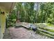 Inviting back deck with built-in seating and a charcoal grill, perfect for outdoor entertaining amid lush greenery at 5357 Highway 81, Loganville, GA 30052