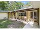 Inviting outdoor patio area with seating, offering a comfortable space to relax and enjoy the pleasant backyard environment at 5357 Highway 81, Loganville, GA 30052