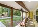Covered porch with seating, perfect for enjoying the outdoor scenery, with a view of the surrounding greenery at 5357 Highway 81, Loganville, GA 30052