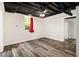 Finished basement bedroom with wood look flooring and natural light at 5357 Highway 81, Loganville, GA 30052