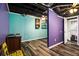 Finished basement area with closet space and colorful accent walls at 5357 Highway 81, Loganville, GA 30052