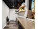 Unfinished basement with exposed ceiling, wood worktable, and storage shelving at 5357 Highway 81, Loganville, GA 30052
