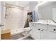 A well-lit bathroom features a walk-in shower with modern tile and double vanity sinks at 5357 Highway 81, Loganville, GA 30052