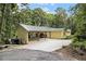 An exterior view of the house showcasing a drive-through garage at 5357 Highway 81, Loganville, GA 30052
