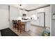 A modern kitchen features white cabinets, a center island, and updated appliances for a sleek design at 5357 Highway 81, Loganville, GA 30052